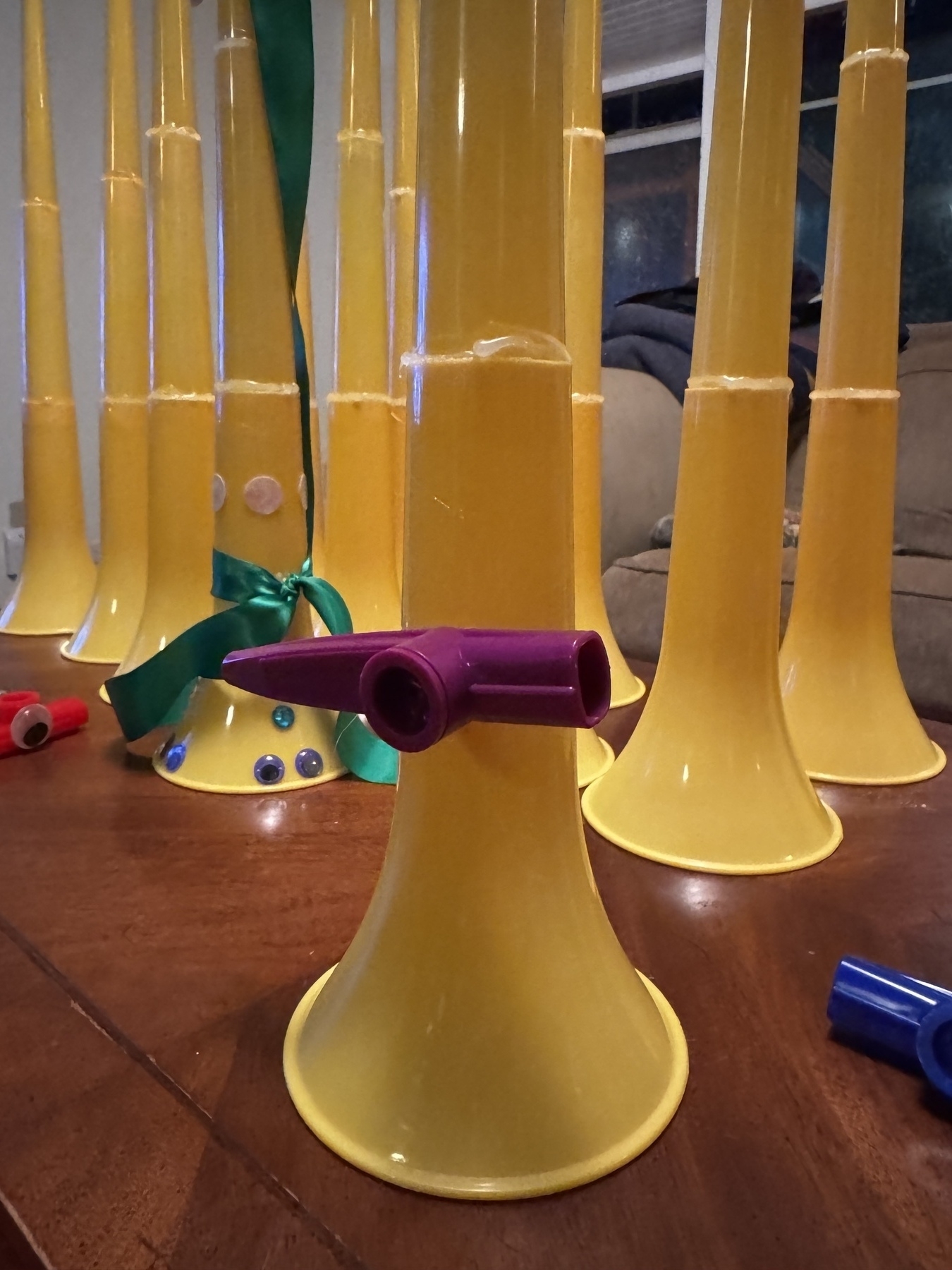 A photo of a kazoo hot glued to a vuvuzela.